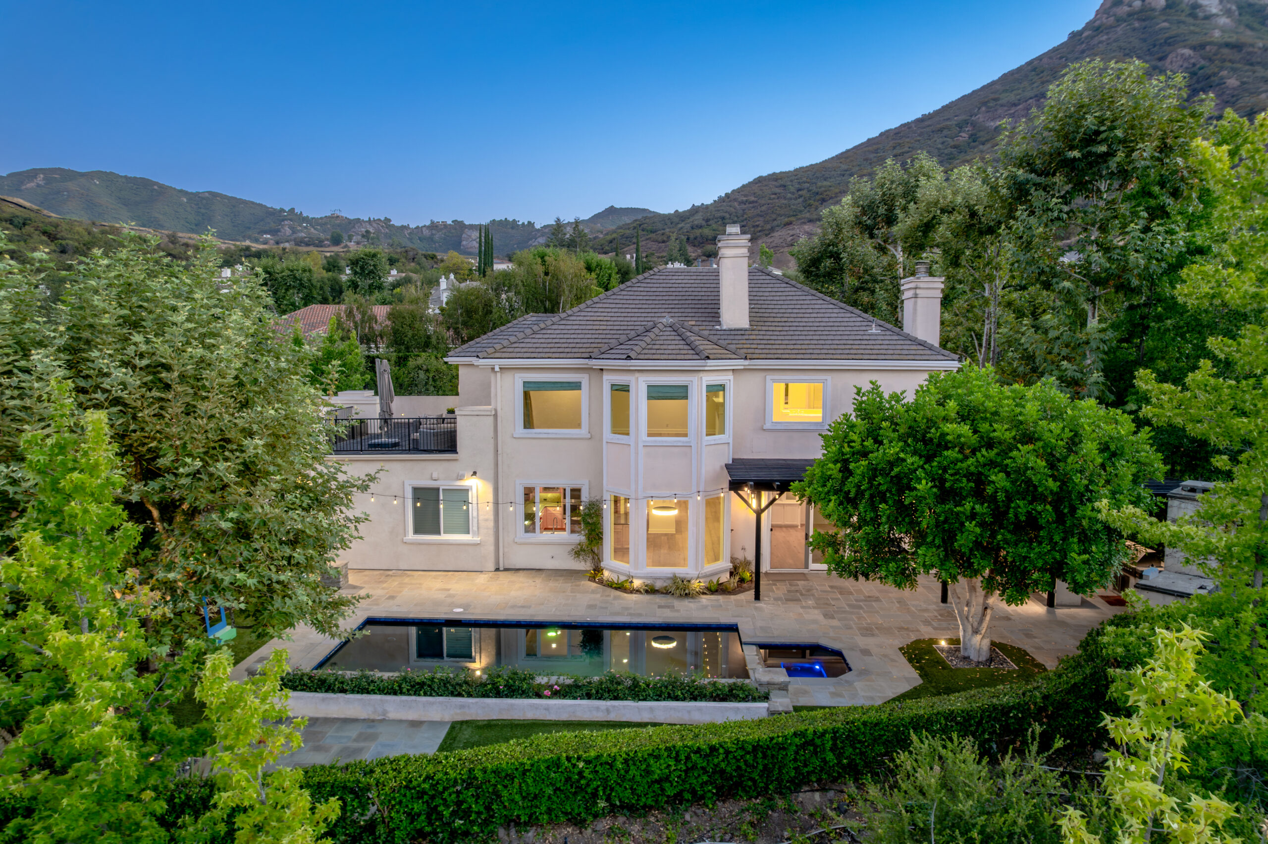Gated luxury estate in the Conejo Valley at dusk, an example of an off-market style luxury home