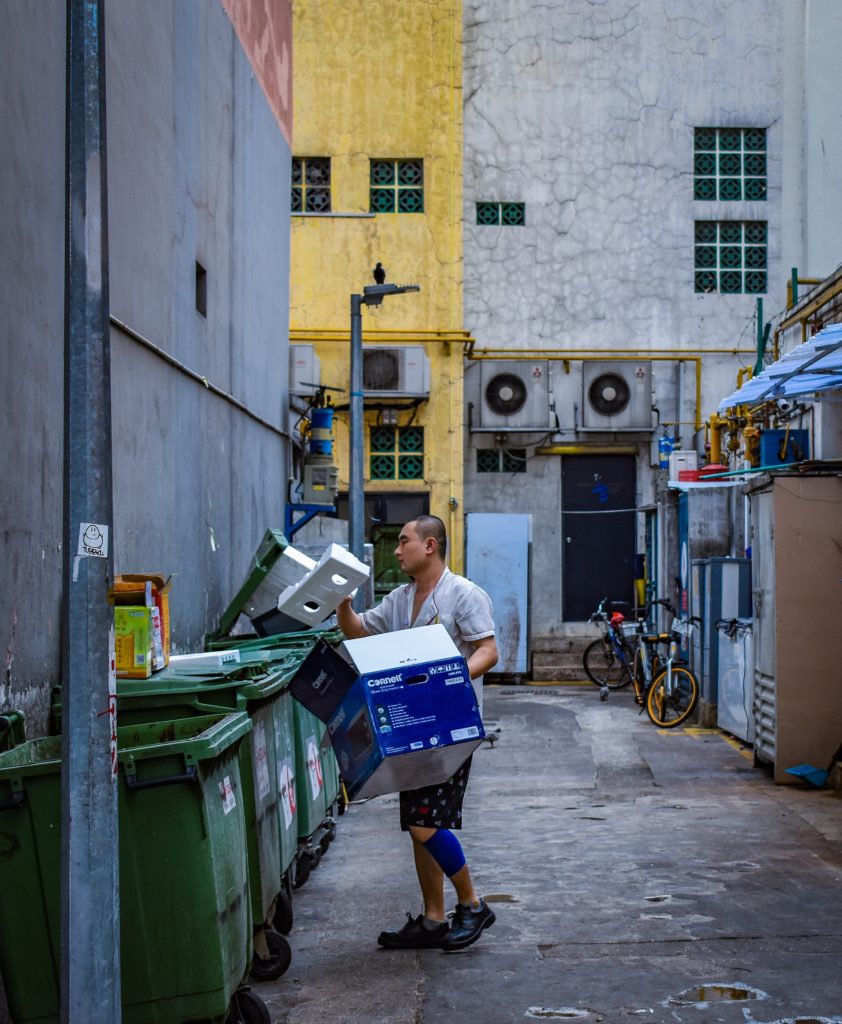 man recycling trash