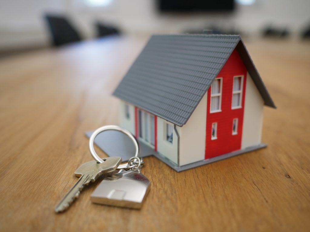 toy house with keys on table