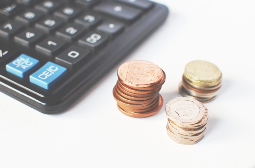 numbers coins next to calculator