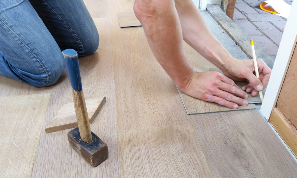 Person working on remodel on floor