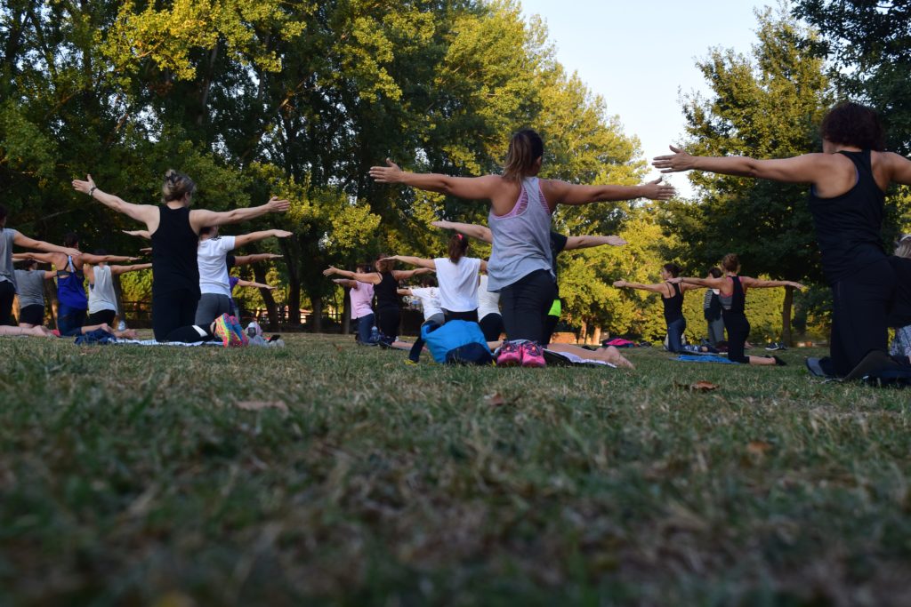 group yoga in grass