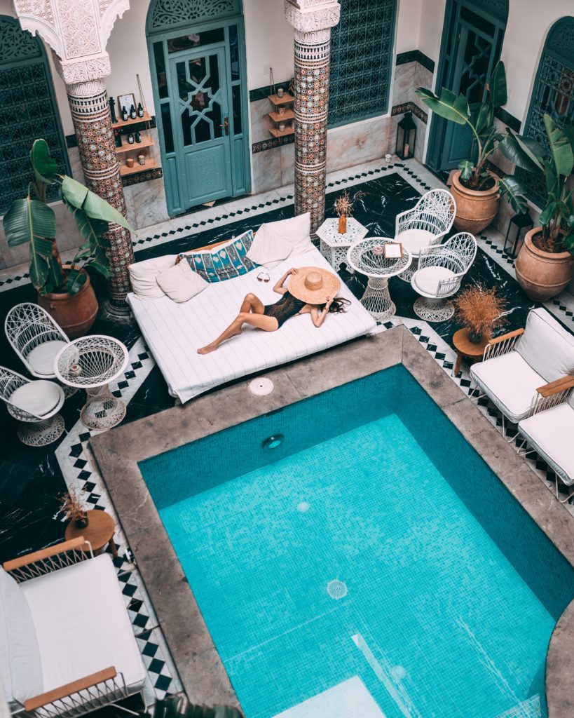 woman by pool in luxury vacationhome