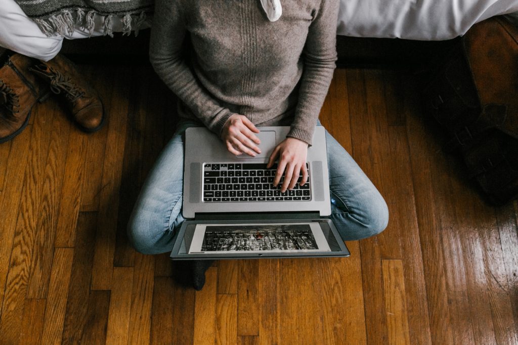 person on laptop researching