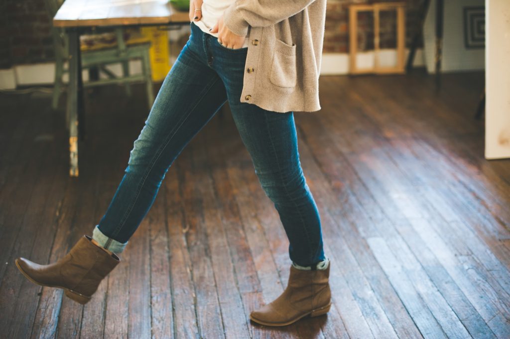 woman walking on hardwood floors
