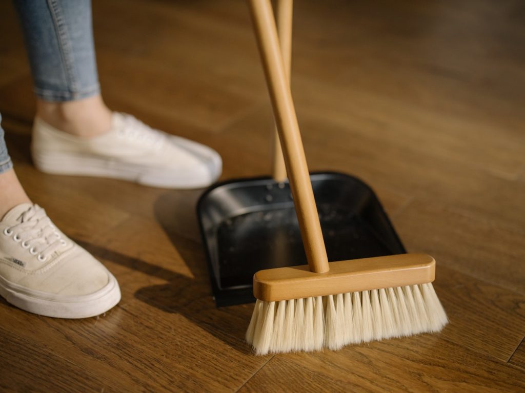 broom on hardwood floor