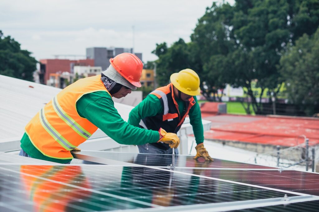 men installing solar panels