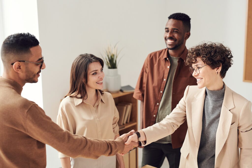 Realtor shaking hands with client