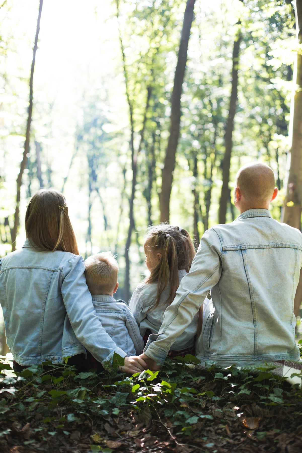 Family walking together near trees discussing estate planning
