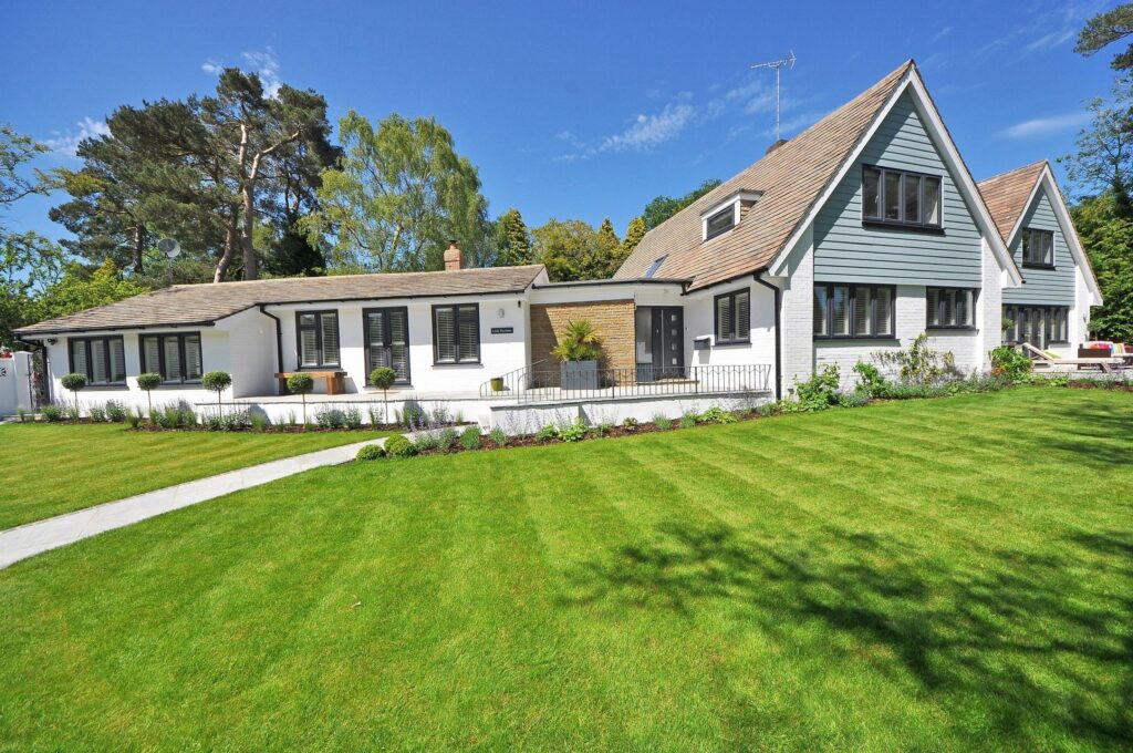 Well-maintained home exterior with manicured lawn, ready for sale