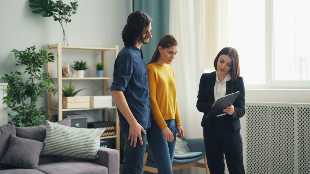 Homebuyers reviewing property details with a real estate agent during a Thousand Oaks home tour